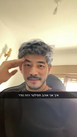 {נ}